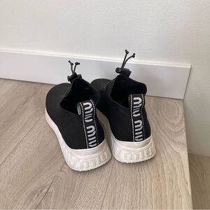 Miu Miu women’s Black Slip-On Sneakers